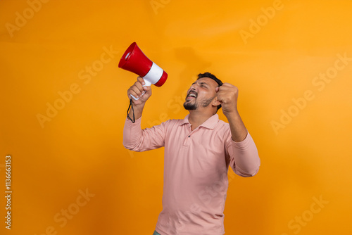 indian man making announcement on megaphone on isolated background
