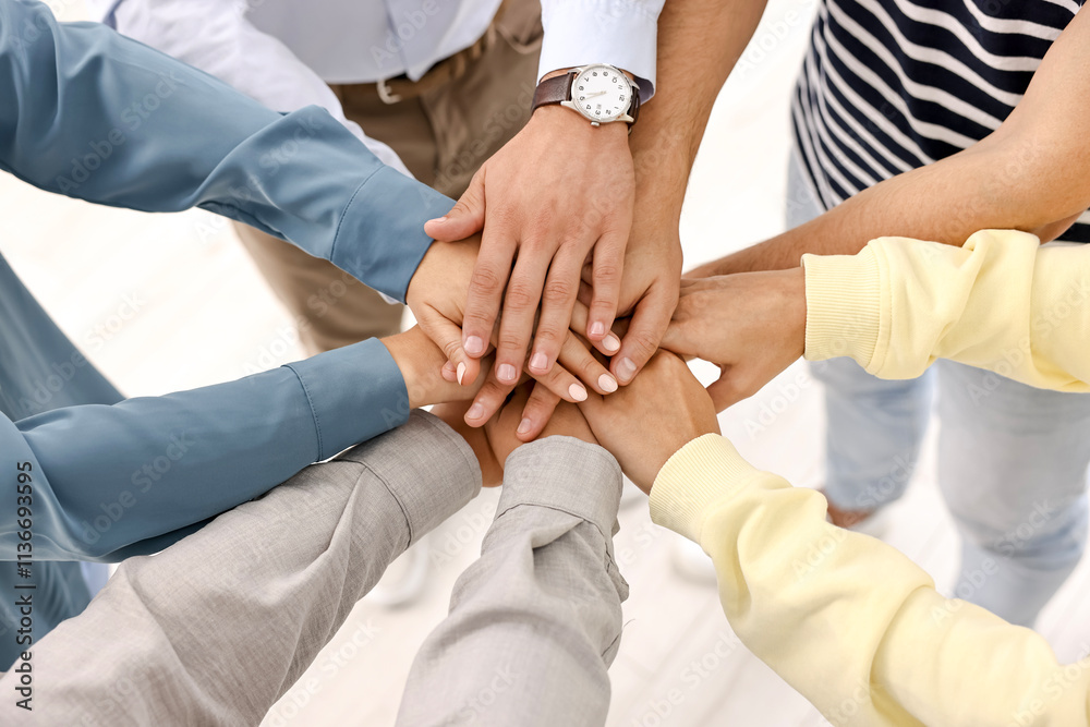 Teamwork. Group of employees joining hands in office, closeup Teamwork. Group of employees joining hands in office, closeup