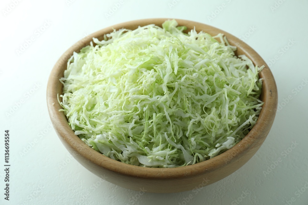 Fresh shredded cabbage on light table, closeup Fresh shredded cabbage on light table, closeup