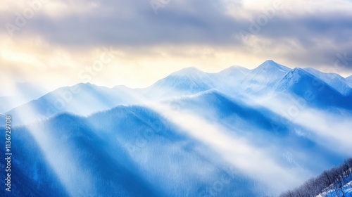 Snow Squall Envelops Mountains in a Mystical Light, Creating a Serene Winter Atmosphere photo