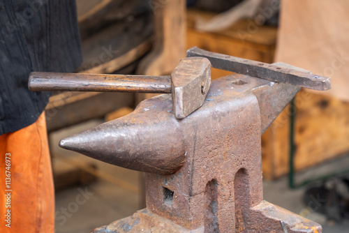 Old Anvil with Hammer in the Blacksmith Shop photo