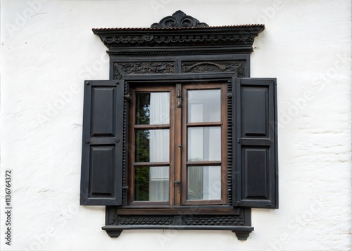 Vintage black open wooden window on white rustic wall. photo