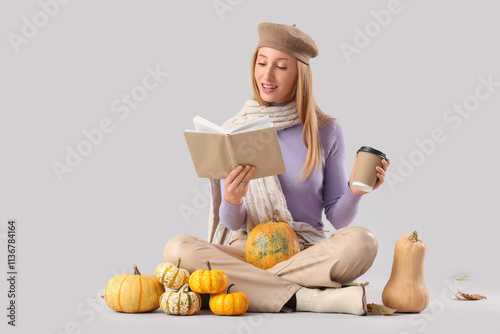 Young woman reading book an...