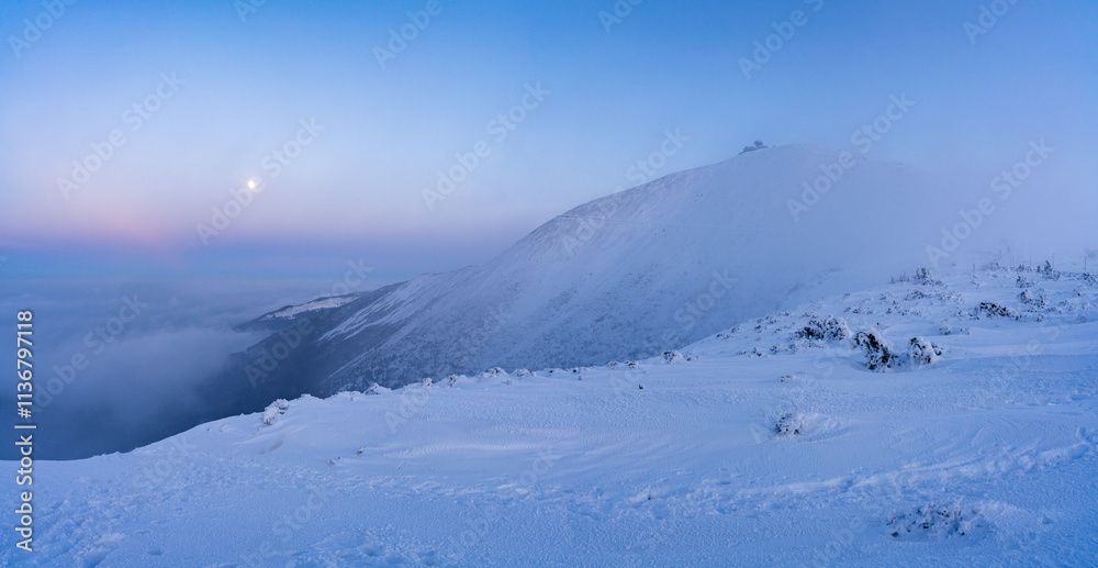 view on Sniezka mountains in Karkonosze at winter dusk in Poland