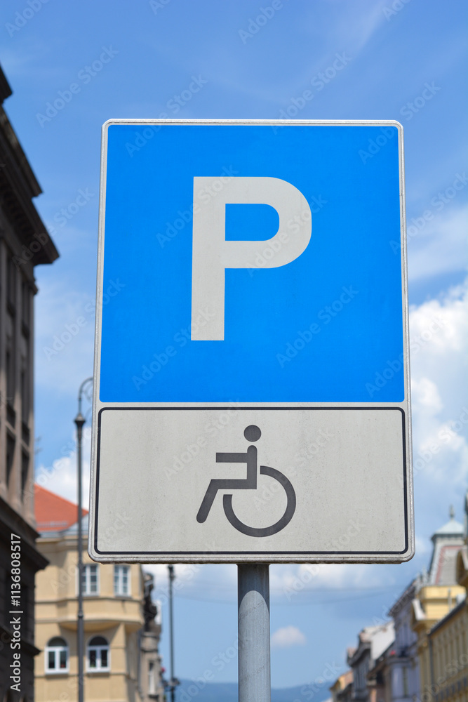 A traffic sign indicating a parking space reserved for persons with disabilities, featuring the international wheelchair symbol A traffic sign indicating a parking space reserved for persons with disabilities, featuring the international wheelchair symbol