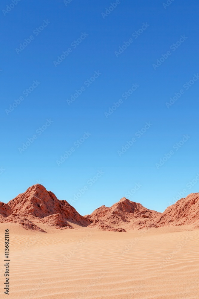 Naklejka premium A vast desert landscape featuring striking red mountains against a clear blue sky.