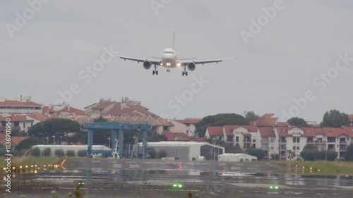 Large passenger airplane landing smoothly on the airport runway, showcasing the excitement of air travel and aviation