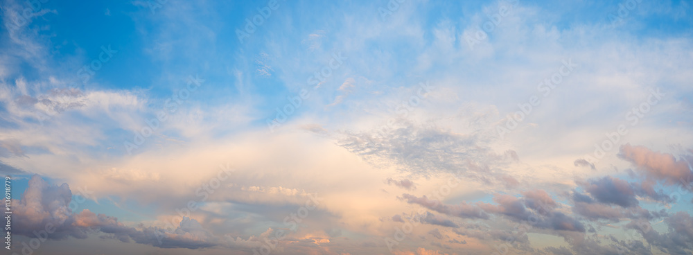 Fototapeta premium The sky is blue panorama with a few clouds. The clouds are white and scattered. The sky is clear and bright