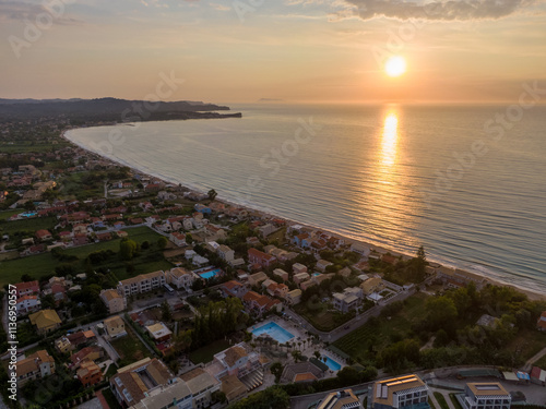 Aerial view of a coastal town at sunset. photo