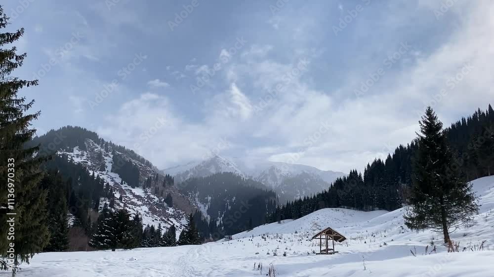 Bright winter morning in the mountains. Blue sky, sunlight, snowdrifts and a gazebo. Smooth camera movement without sound Bright winter morning in the mountains. Blue sky, sunlight, snowdrifts and a gazebo. Smooth camera movement without sound