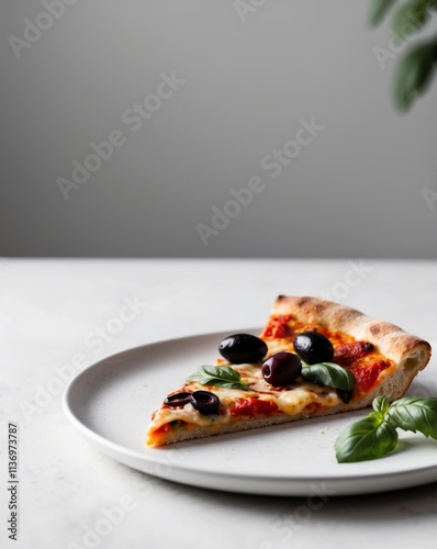 a slice of pizza with olives and basil leaves