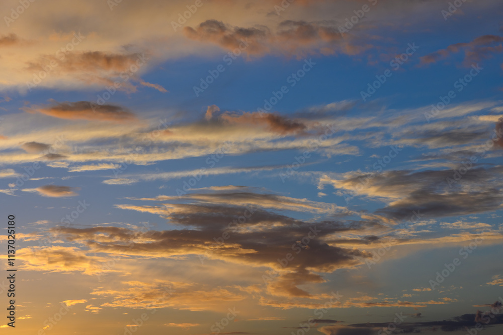 Serene sunset paints the sky in vibrant hues over the horizon with wispy clouds drifting lazily Serene sunset paints the sky in vibrant hues over the horizon with wispy clouds drifting lazily
