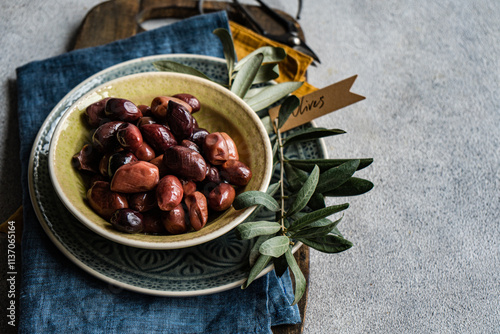 Greek BBQ olives with rustic setting photo