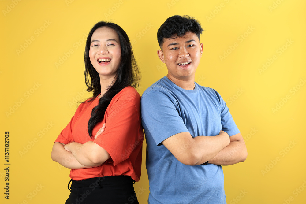 Fototapeta premium Portrait of Cheerful Young Couple Smiling with Crossing Arm, Standing Together