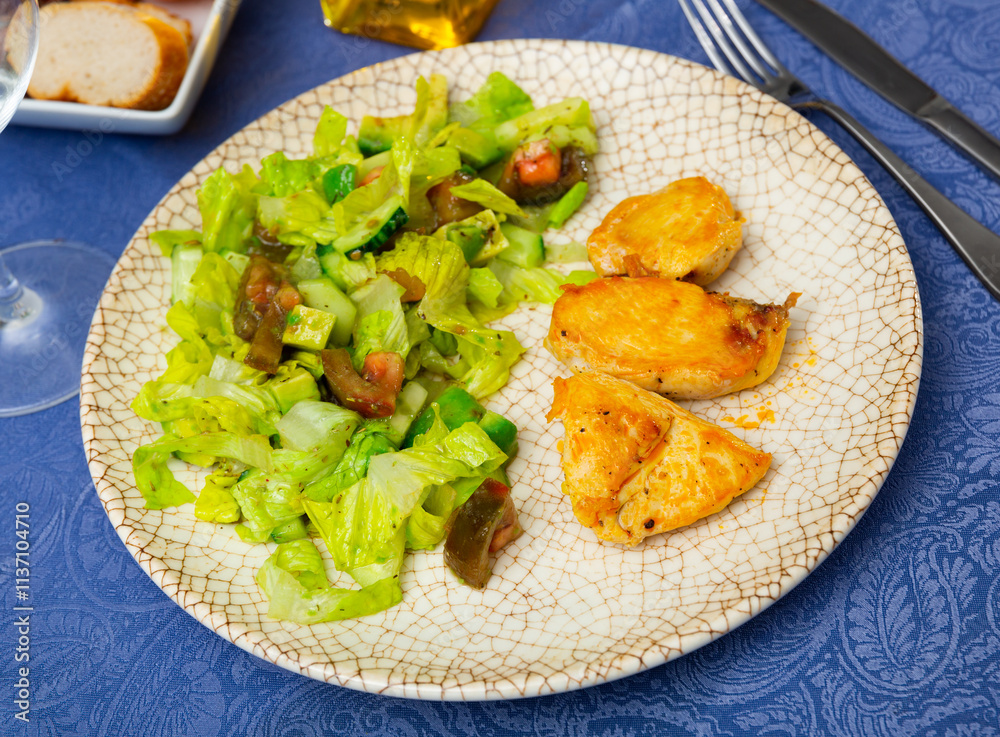 Fresh salad with chicken breast and lettuce on a plate Fresh salad with chicken breast and lettuce on a plate