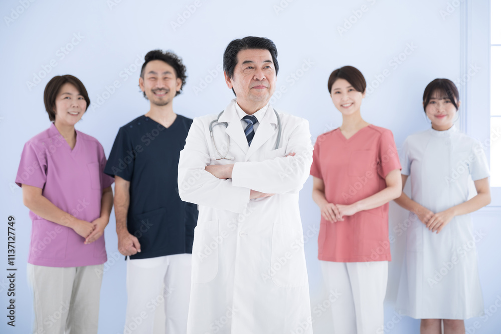 Image of multiple (5) side-by-side healthcare professionals Doctor and nurse, physical therapist team Standing Looking up Thinking Doctor light blue background Image of multiple (5) side-by-side healthcare professionals Doctor and nurse, physical therapist team Standing Looking up Thinking Doctor light blue background