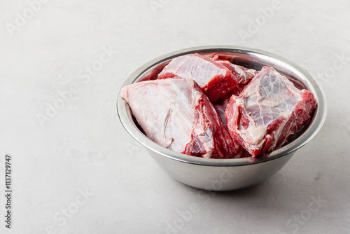 Raw beef ribs in bowl