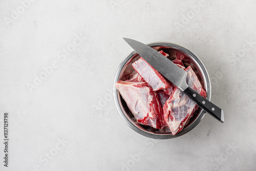 Raw beef ribs in bowl