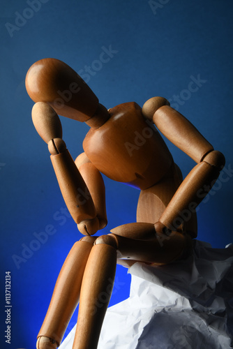 Poseable mannequin engaged in thought and depicting various emotions photo