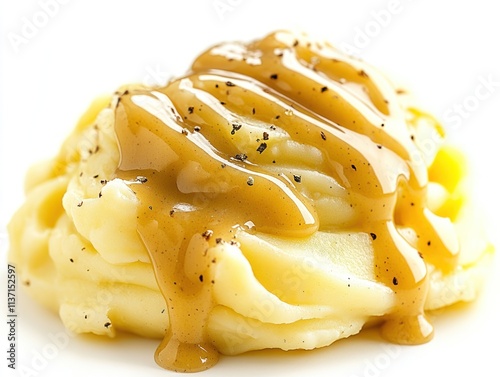 A serving of creamy mashed potatoes topped with savory gravy. photo