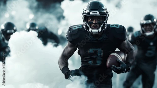 Wallpaper Mural A Black American football player running with the ball, wearing an American helmet and dark uniform in front of other players standing on both sides of him, white smoke around them Torontodigital.ca