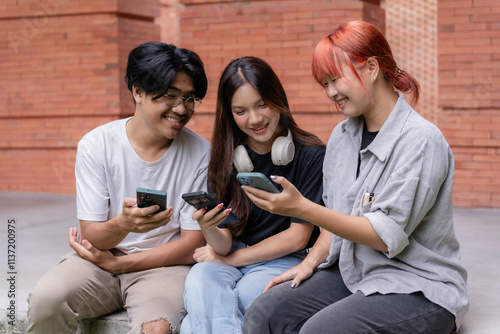 Young people enjoying time together while using mobile phones, sharing videos and photos on social networks, and connecting with friends