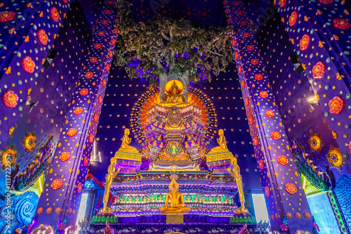 Wat Klang Khlong Watthanaram, or Wat Muang, in Sena, Ayutthaya, is famed for its vibrant purple ordination hall and intricate decorations, making it a notable landmark in the area.