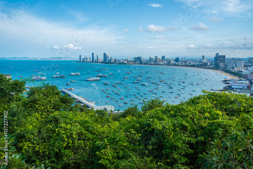 The Khao Phra Tamnak Viewpoint is a popular attraction in Pattaya, located on Phra Tamnak Hill. It offers stunning views of the city, the blue sea, blue sky, and numerous boats docked in Pattaya Bay