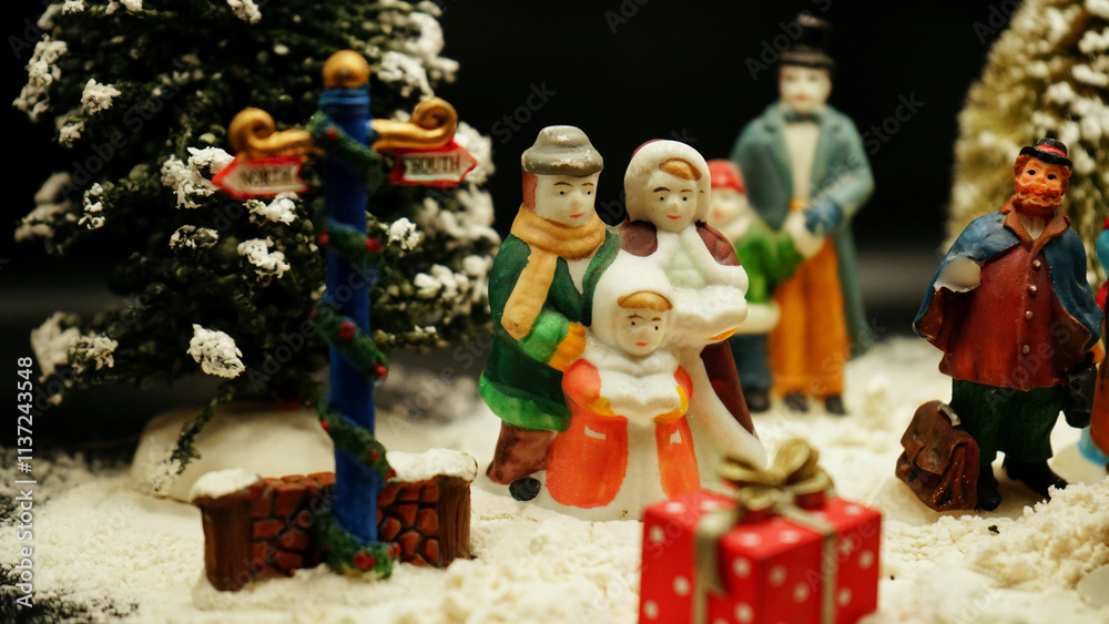 Naklejka premium Christmas decorations, ointments, miniatures, trees, people with background of snow and rocks