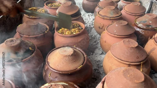 Stuffing of onions and chicken into clay handis. Bihari style chicken recipe. photo