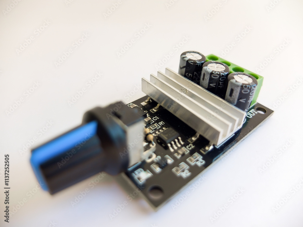 DC Motor speed controller board that regulates motor speed on a white background