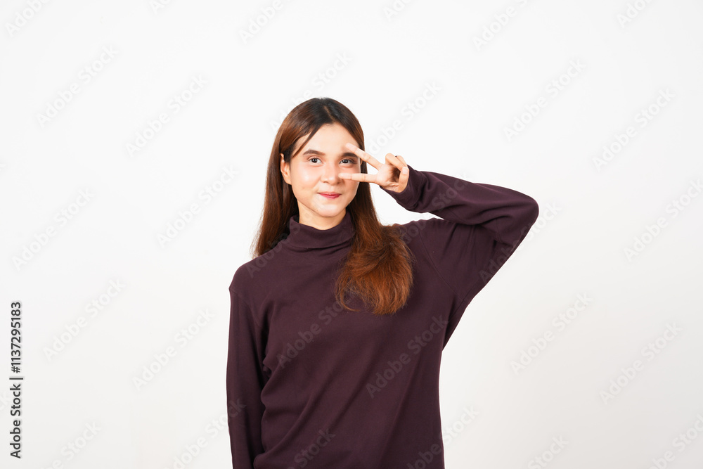 Smiling looking at camera and showing Peace or Victory Sign two finger Of Beautiful Asian Woman Isolated On White Background Smiling looking at camera and showing Peace or Victory Sign two finger Of Beautiful Asian Woman Isolated On White Background
