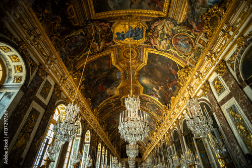 Fotografie Iconic Ceiling Frescoes and Chandeliers in the Hall of Mirrors of Versailles Pal