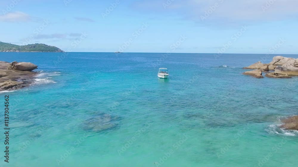 Felicite Island, close to La Digue, Seychelles. Aerial view of tropical coastline on a sunny day Felicite Island, close to La Digue, Seychelles. Aerial view of tropical coastline on a sunny day