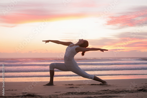 Silhouette of a yoga pose on the beach at sunrise, representing peace and balance photo