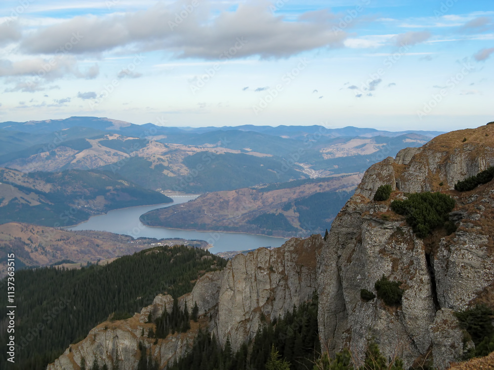 Fototapeta premium Ceahlau Massif and Bicaz Lake with Partly Cloudy Sky in Romania