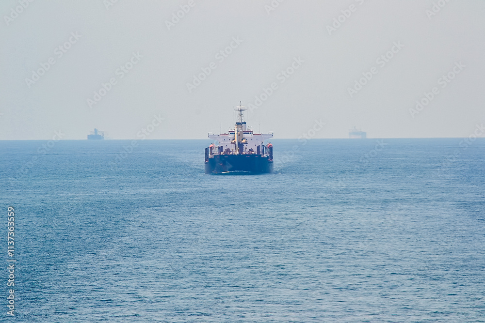 A large ship is sailing in the ocean A large ship is sailing in the ocean