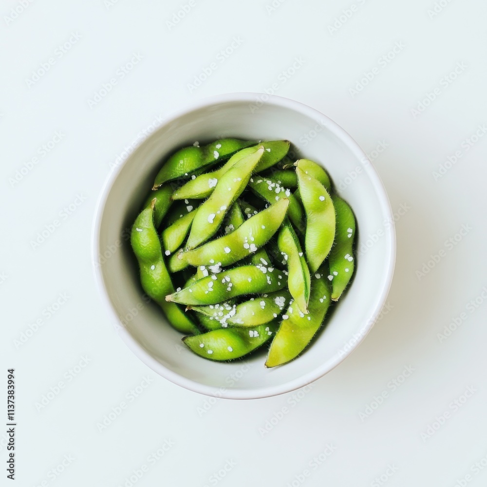 A simple bowl of plain edamame, lightly salted and served in a minimalist white ceramic bowl, Edamame centered A simple bowl of plain edamame, lightly salted and served in a minimalist white ceramic bowl, Edamame centered