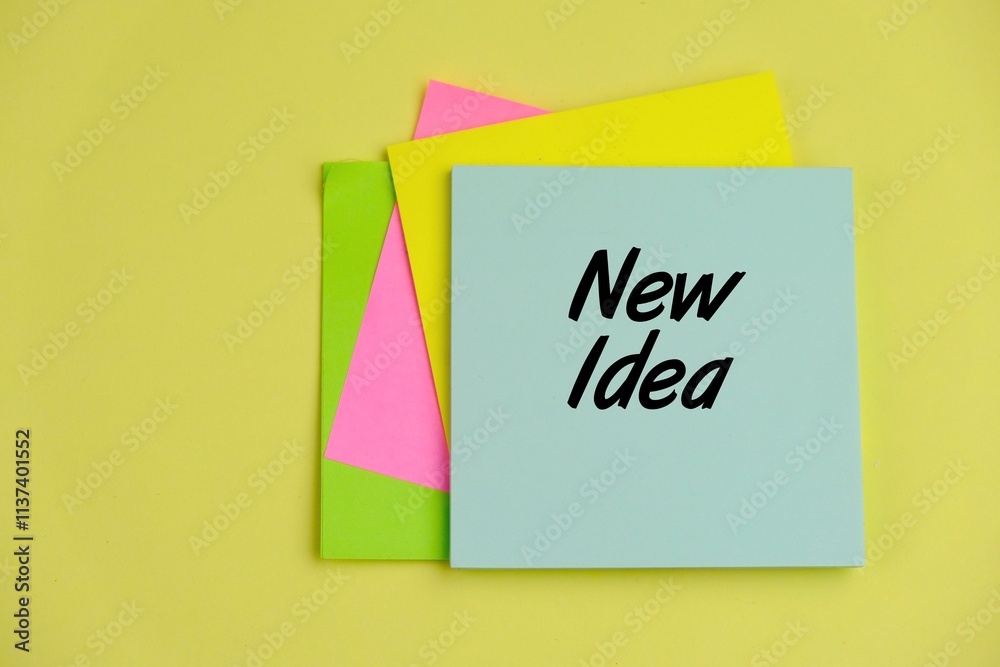 text of new idea on colorful note pad text of new idea on colorful note pad