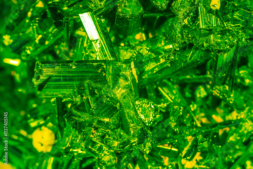 Green crystal mineral stone. Gems. Mineral crystals in the natural environment. Texture of precious and semiprecious stones. Seamless background with copy space colored shiny surface of precious stone photo