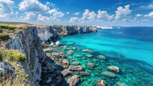 High-end photography of a picturesque coastal landscape with cliffs and a turquoise sea under a bright blue sky
