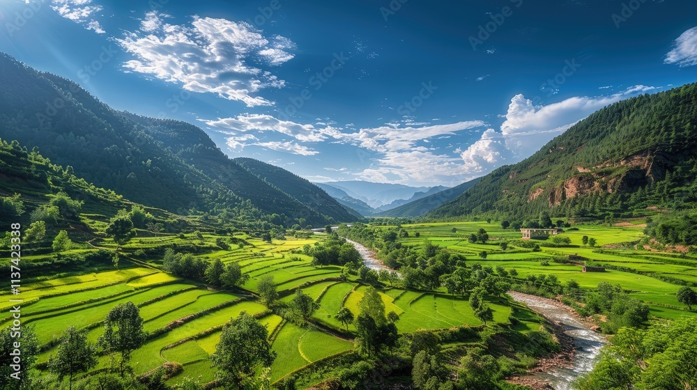 Fototapeta premium High-end photography of a picturesque valley with a river and lush green fields under a bright blue sky