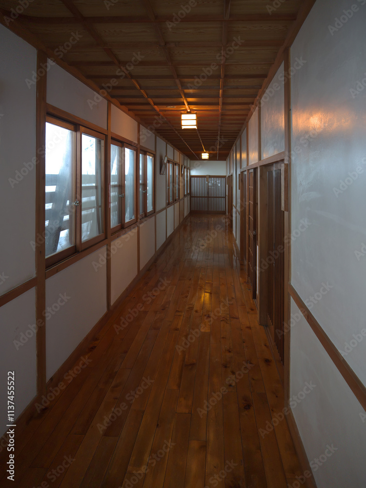 Long Japanese house corridor with wooden sliding doors Long Japanese house corridor with wooden sliding doors