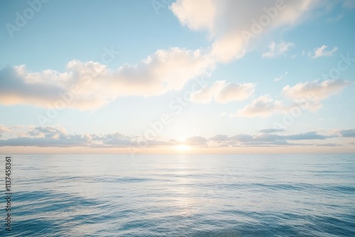 Calm Ocean with Gentle Waves Under Drifting Clouds