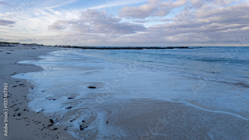 An early morning view of a sandy beach along the Agulhas National Park coastline (L'Agulhas), Overberg, Western Cape. South Africa photo