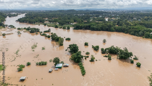 Aerial view of Mae Kok river rising and flooding rural area in Chiang Rai province of Thailand. This river is the blood line for people of Chiang Rai, started from the hills on boarder of Myanmar. photo