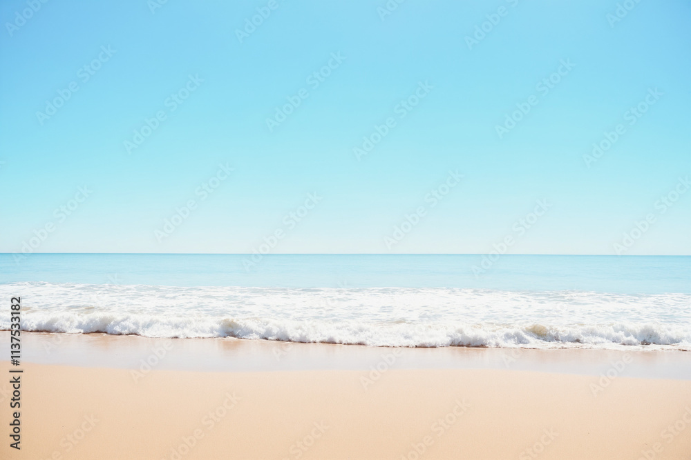 Sandy beach with soft blue waves Sandy beach with soft blue waves