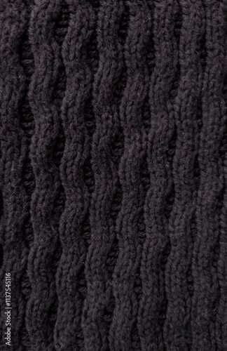 black  Wool fabric photographed close-up in a special design. Texture stands out with material. Clothing background sweater