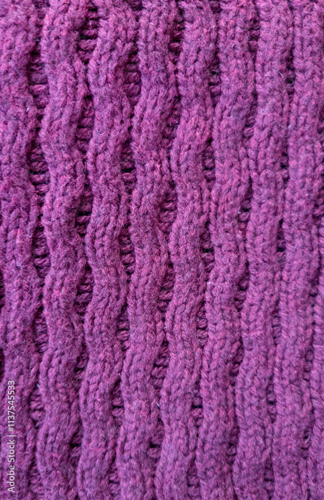 pink knitted Wool fabric photographed close-up in a special design. Texture stands out with material. Clothing background sweater pink knitted Wool fabric photographed close-up in a special design. Texture stands out with material. Clothing background sweater