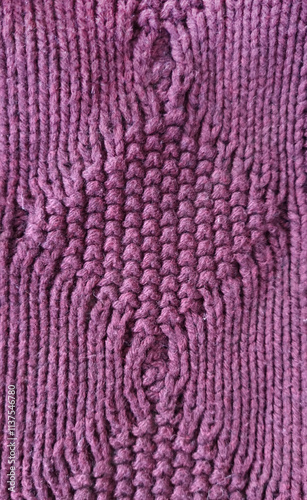 Wool fabric photographed close-up in a special design. Texture stands out with material. Clothing background sweater